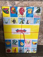Front of sealed pack showing Lotería artwork and Notebook Collection band