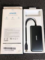 Front of box with hub in tray