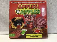 Front of sealed Apples to Apples box showing artwork and age/player info