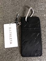 Front view of Athleta Coffee Run Wallet 2.0 with tag attached