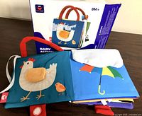 Front of book and retail box, shows chicken and umbrella pages