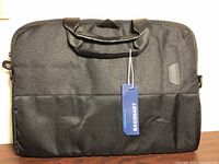 Front view of black BagSmart laptop messenger bag with tag attached