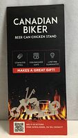 Front of boxed Canadian Biker beer can chicken stand showing product name and features