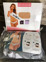 Front of boxed castor oil pack set with contents displayed