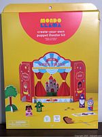 Front of boxed Mondo Llama create-your-own puppet theater kit