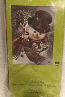 Front of sealed package displaying Snowman Snuggles flag image and size 29" x 43"