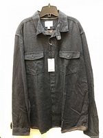 Front view of navy textured Goodfellow shirt on hanger with tags visible