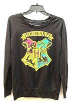 Front view showing Hogwarts crest graphic and overall condition