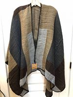 Front view of colour-block poncho scarf hanging