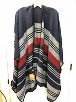 Full view of striped poncho scarf hanging
