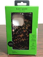 Front of sealed Kate Spade iPhone 15 Pro case in retail box
