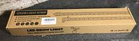 Sealed retail box labeled LED Grow Light Strip full spectrum with auto on/off
