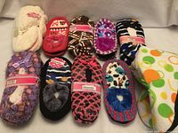 Full set of ten slipper pairs laid out