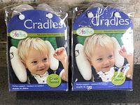 Front view of two packaged StoHua Cradles adjustable head supports