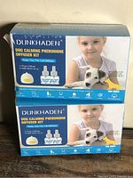 Front view of two sealed Dunkhaden diffuser kit boxes