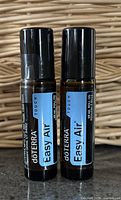 Front view of the two doTERRA Touch Easy Air roll-on bottles