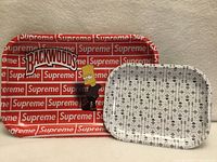 Both trays standing upright, showing overall designs and relative sizes