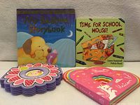 All four board books front covers visible