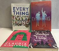 Front view of all four paperback novels