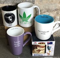 Group image of five mugs showing fronts and interiors