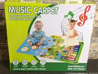 Front of box showing product image, name and kids on mat