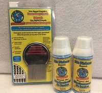 Front view of nit comb package with two treatment bottles