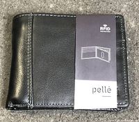 Front view of black leather bifold wallet with pellè branded paper sleeve indicating RFID protection