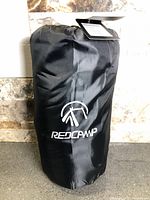 Black stuff sack with Redcamp logo containing liner