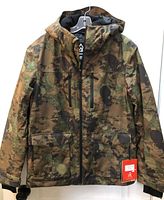 Front view Ripzone camo winter coat showing zipper, pockets, tag