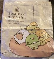 Front of tote showing printed design and branding