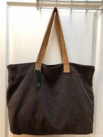 Front view of brown corduroy Wild Fable tote bag hanging.