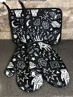 Set laid out showing two mitts and potholder, pattern visible