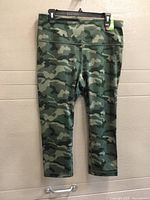 Front view of camouflage leggings hanging