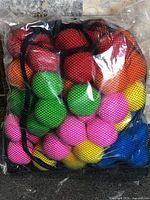 Full bag showing multicoloured sponge balls in mesh packaging