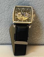 Front view of watch showing dial and strap