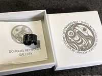 Ring in open Douglas Reynolds Gallery box with gallery card