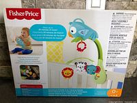 Front of unopened Fisher-Price Rainforest Friends 3-in-1 Musical Mobile box