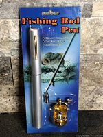 Front of sealed package showing silver pen-style rod and gold reel