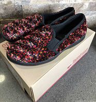 Side view of slippers on box