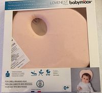 Front of sealed retail package showing pink Lovenest pillow