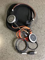 Headset with inline controller and case displayed