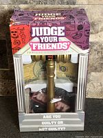 Front of sealed Judge Your Friends game box showing contents through window