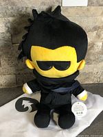 Front view of MiniBloxia plush with bag