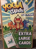 Front of sealed yoga cards box showing branding and illustrations