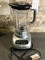 Full view of KitchenAid blender with pitcher, lid, and cord