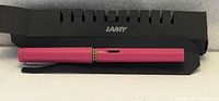 Pen inside its black slotted Lamy sleeve