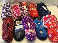Ten pairs assorted slippers arranged in two rows
