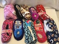 All ten pairs of assorted slippers displayed together
