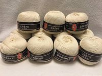 Ten balls forming base row, one on top; labels show Durable Crêpe branding