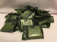 Pile of individually packaged green Rituals facial soap bars
